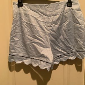 Blue flowy shorts with lace trim